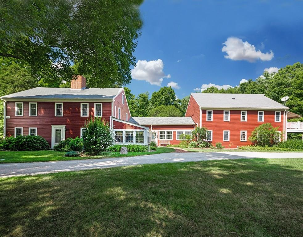 61 West Acton Road Stow, MA 01775 - Photo 3 of 39 a front view of a house with a garden