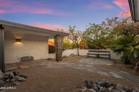 a view of a house with a tree