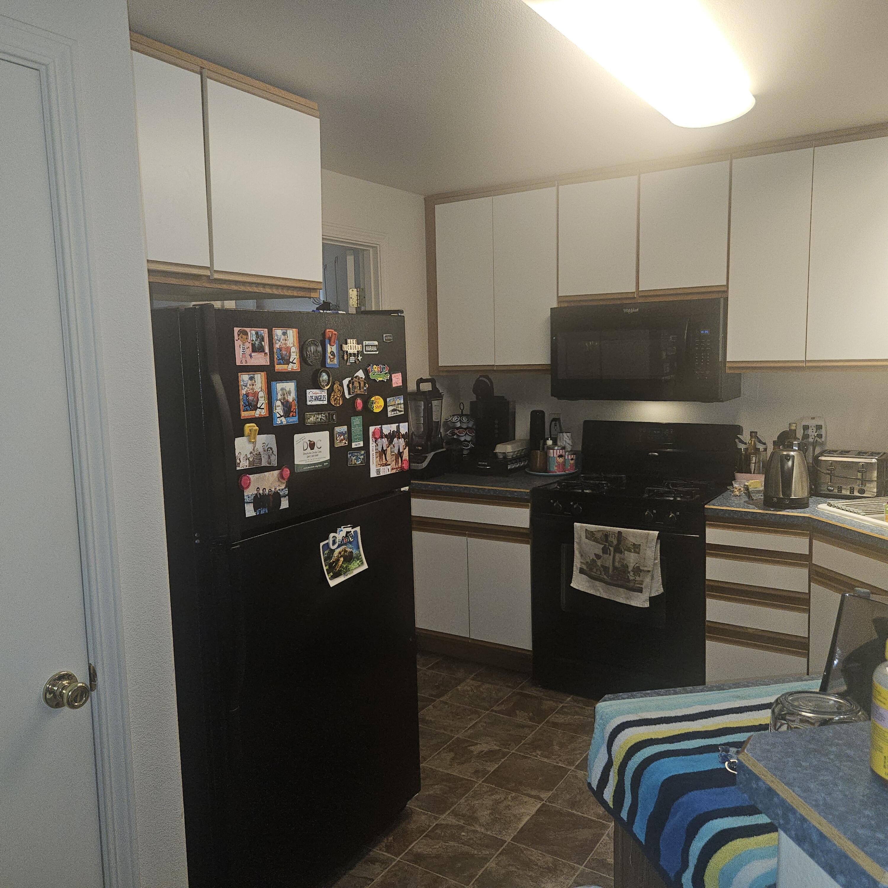 569 Northeast Negus Loop Redmond, OR 97756 - Photo 25 of 32 a kitchen with stainless steel appliances a refrigerator and a sink