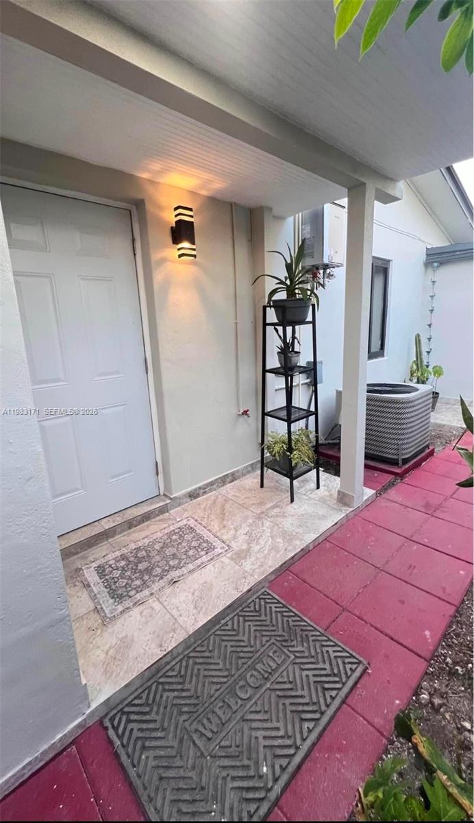 a bedroom with a bed and a rug