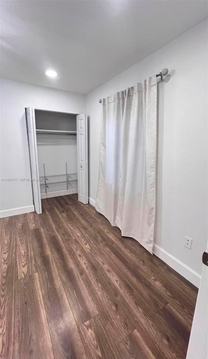 13030 Southwest 84th Street, Unit B Miami, FL 33183 - Photo 6 of 10 a view of empty room with wooden floor
