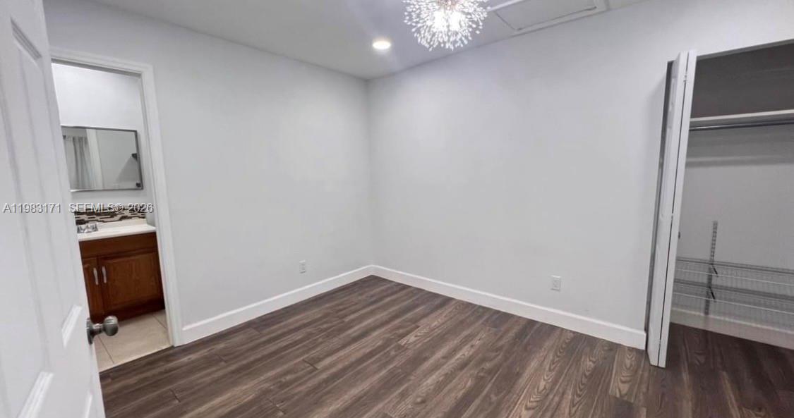 13030 Southwest 84th Street, Unit B Miami, FL 33183 - Photo 7 of 10 wooden floor in an empty room
