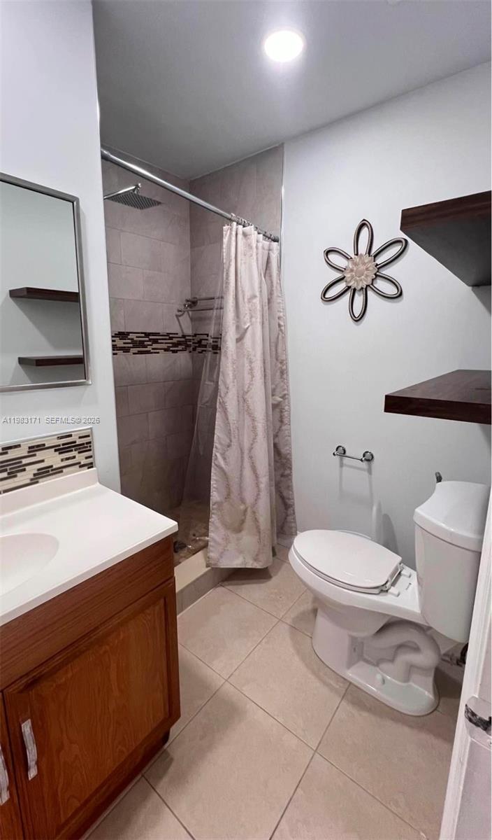 13030 Southwest 84th Street, Unit B Miami, FL 33183 - Photo 9 of 10 a bathroom with a sink toilet and shower