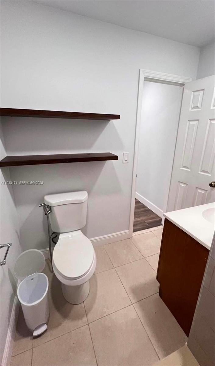 13030 Southwest 84th Street, Unit B Miami, FL 33183 - Photo 10 of 10 a bathroom with a toilet and a sink