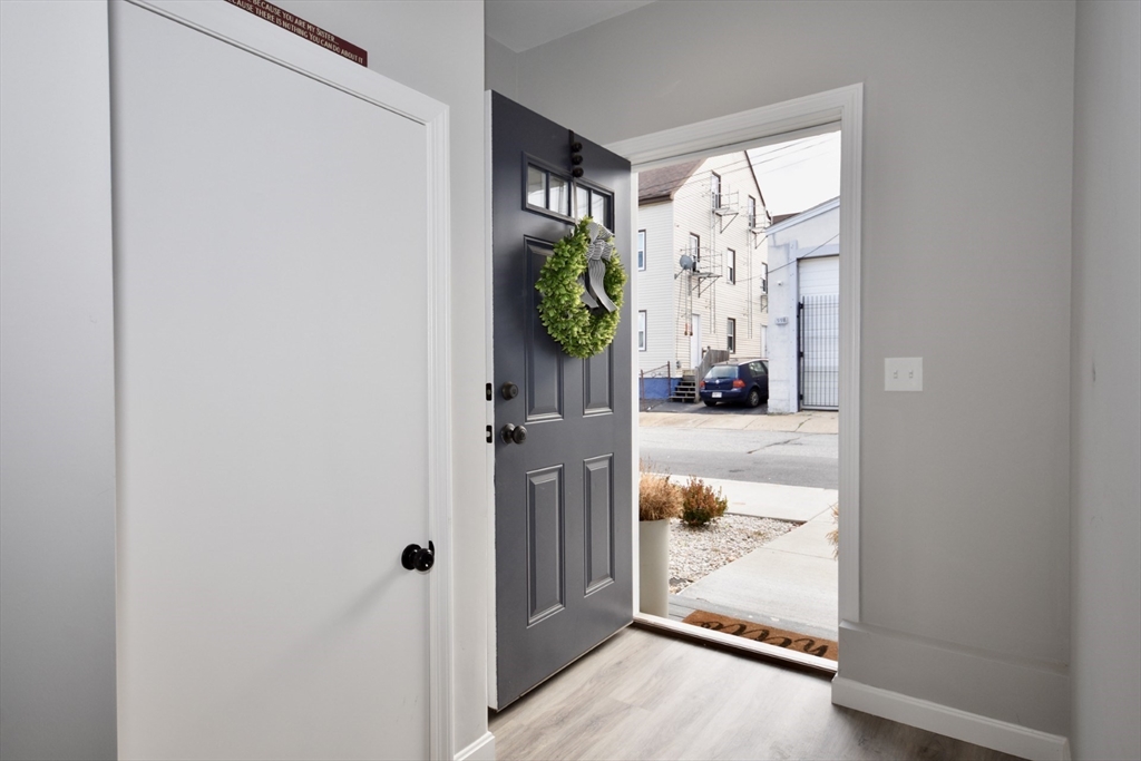 550 Spring Street, Unit 2 Fall River, MA 02721 - Photo 3 of 13 a view of a hallway to rooms