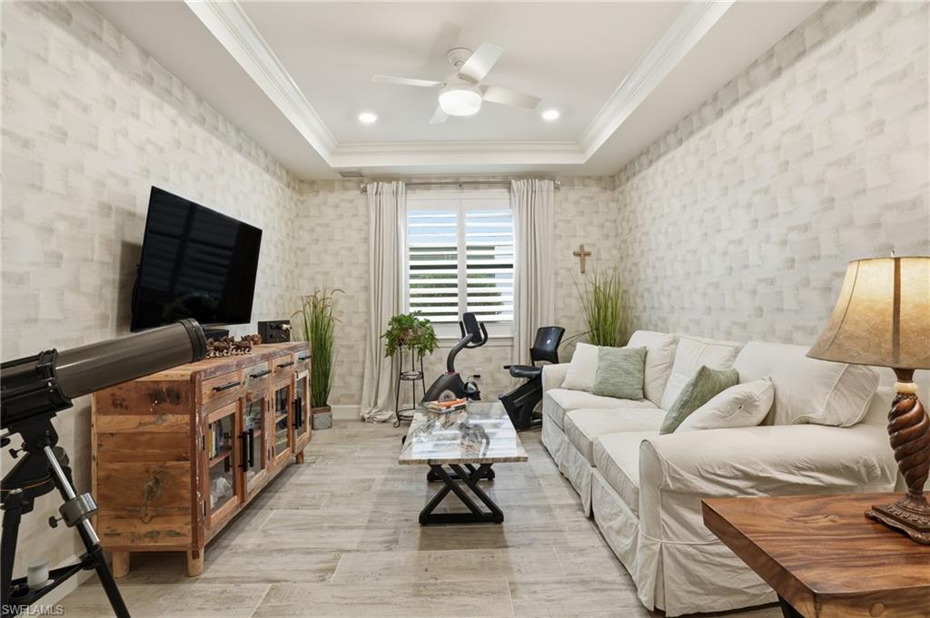 17210 Ashcomb Way Estero, FL 33928 - Photo 14 of 47 a living room with furniture and a flat screen tv