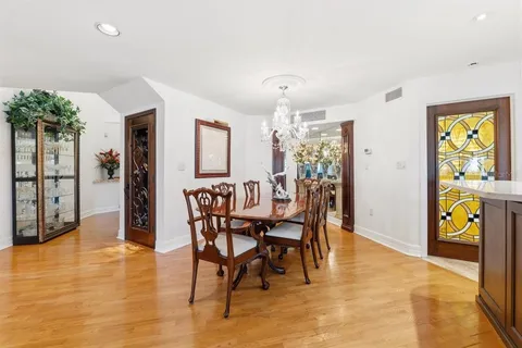 a spacious bathroom with double vanity and a mirror