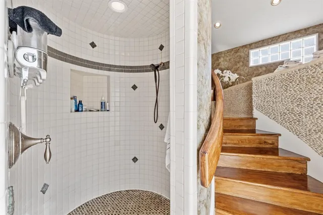 a view of a chair and tables in the patio in front of a house