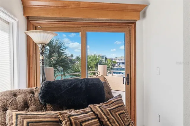 a view of a swimming pool with a patio and a yard