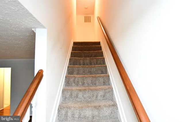 a bathroom with a shower sink and mirror