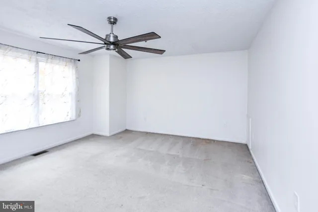 a car parked in front of a house