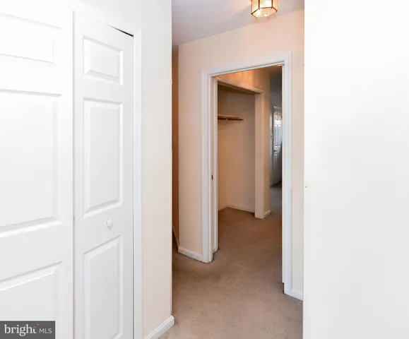 a view of backyard with swimming pool and seating space