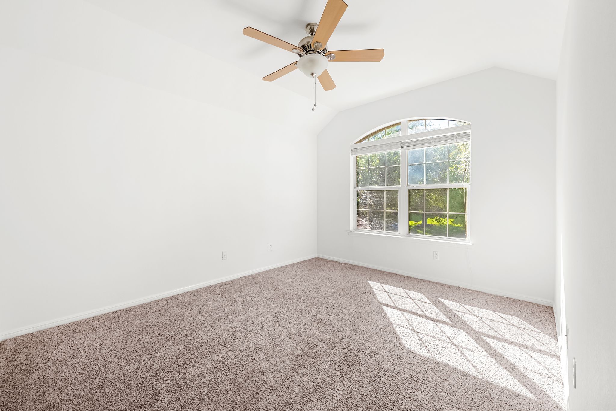 2708 Rio Mesa Drive Austin, TX 78732 - Photo 23 of 40 an empty room with a window and a fan