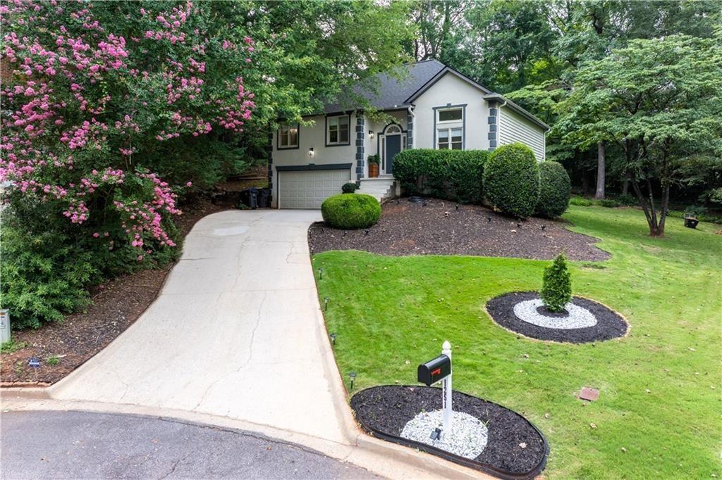 a house view with a garden space