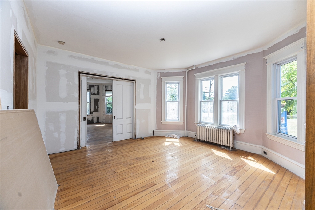 29 Gorham Street Chelmsford, MA 01824 - Photo 17 of 42 wooden floor in an empty room with a window