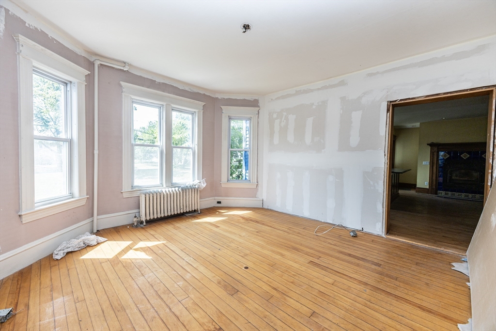 29 Gorham Street Chelmsford, MA 01824 - Photo 18 of 42 a view of empty room with wooden floor and fan