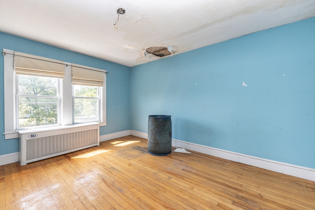 29 Gorham Street Chelmsford, MA 01824 - Photo 24 of 42 a view of empty room with wooden floor and fan