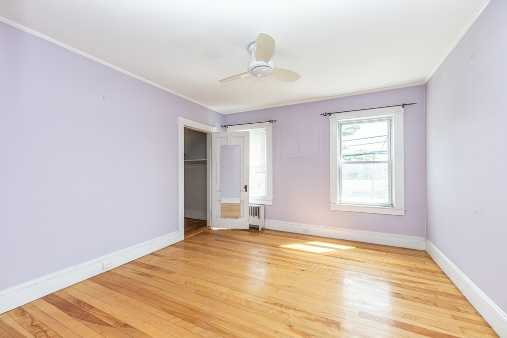 29 Gorham Street Chelmsford, MA 01824 - Photo 25 of 42 a view of empty room with wooden floor and fan
