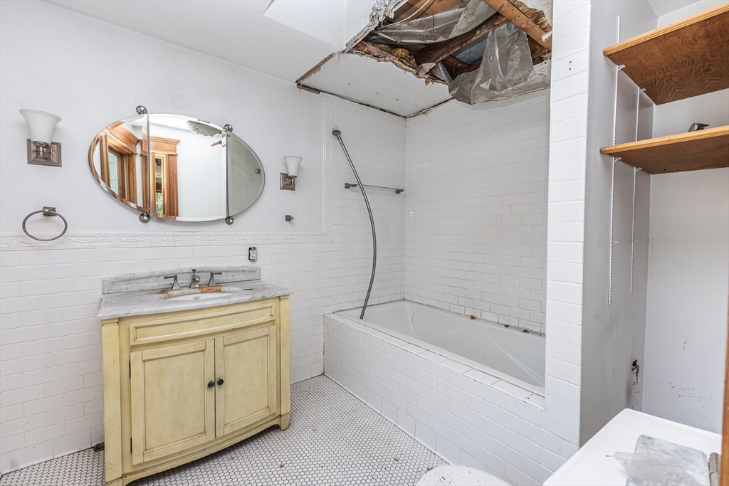 29 Gorham Street Chelmsford, MA 01824 - Photo 34 of 42 a bathroom with a granite countertop sink a toilet and bathtub