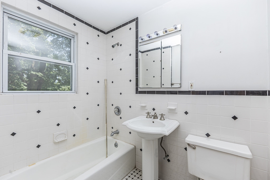 29 Gorham Street Chelmsford, MA 01824 - Photo 35 of 42 a bathroom with a sink toilet and shower