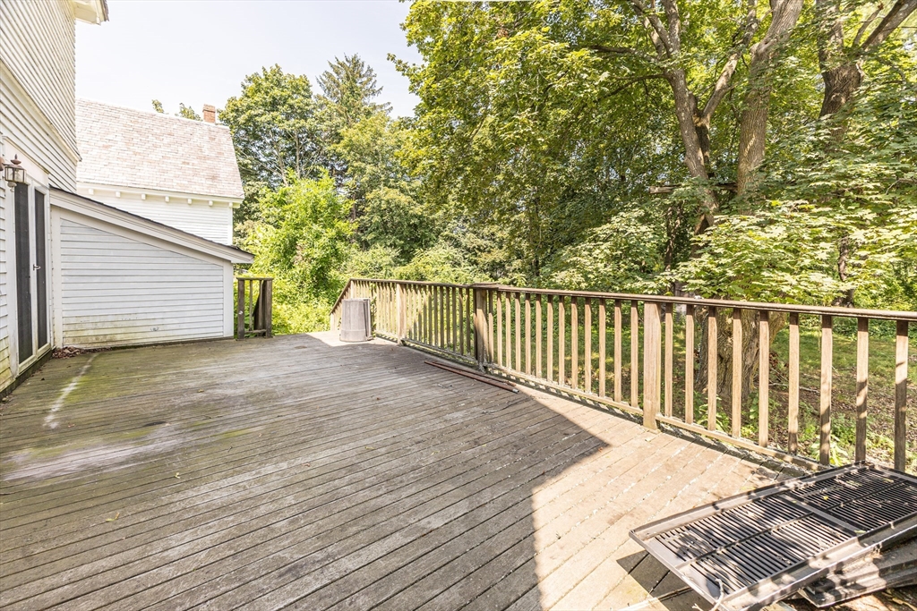 29 Gorham Street Chelmsford, MA 01824 - Photo 37 of 42 a view of a balcony with wooden floor and fence