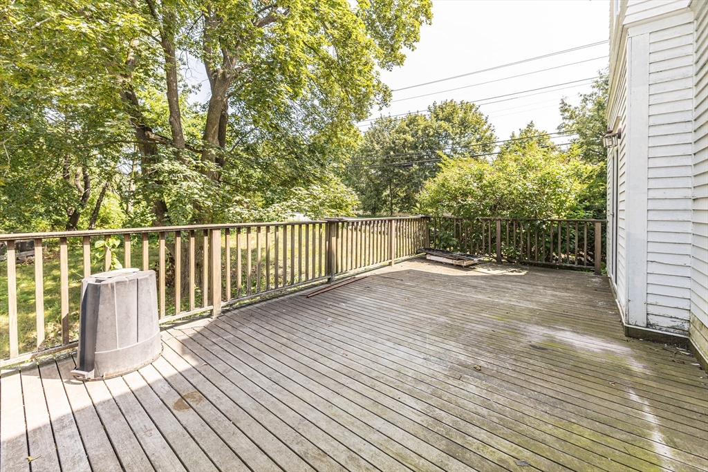 29 Gorham Street Chelmsford, MA 01824 - Photo 38 of 42 a view of a deck with wooden floor and fence