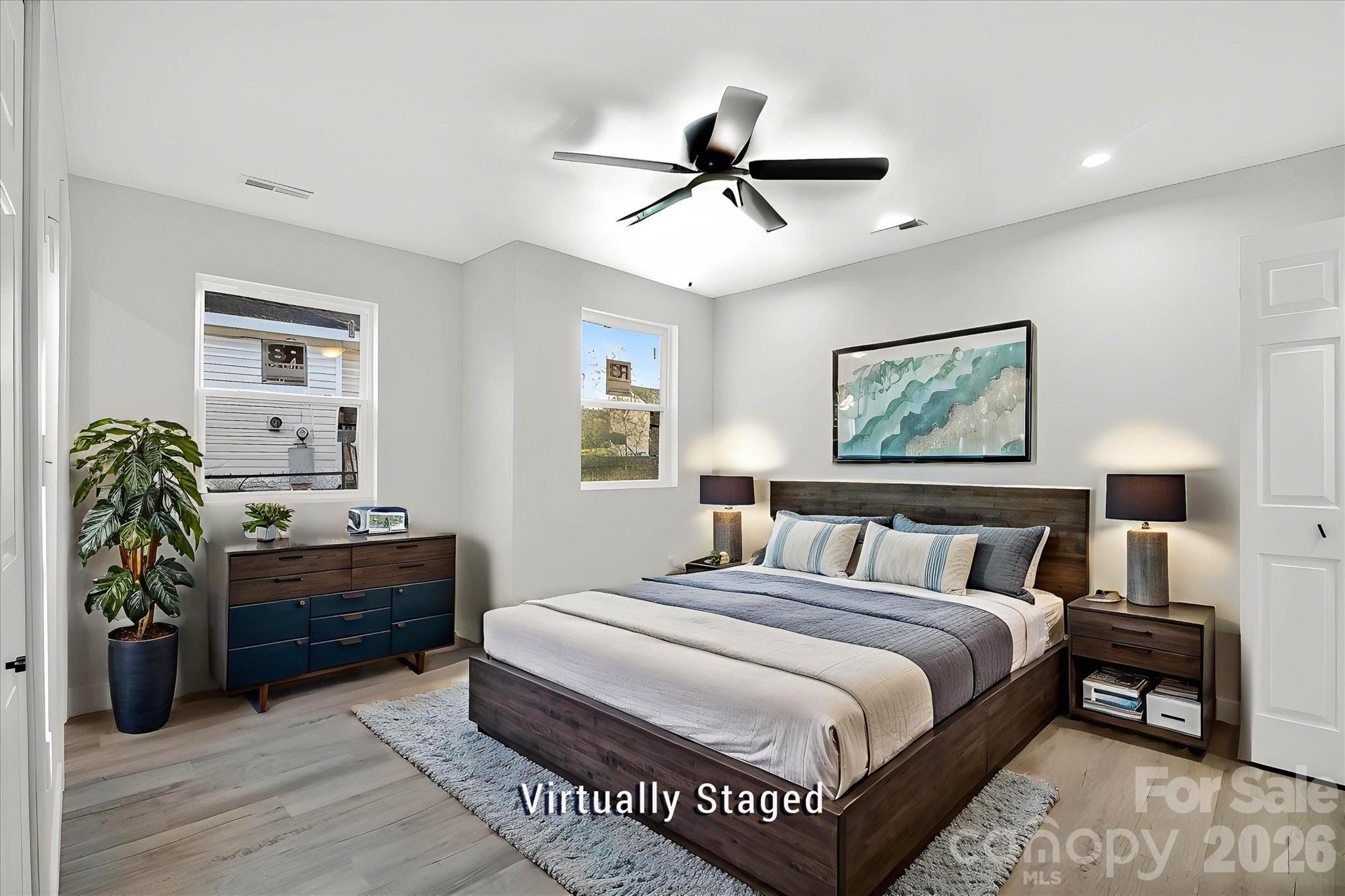 817 Mable Avenue Kannapolis, NC 28083 - Photo 11 of 20 a bedroom with a bed and a chandelier