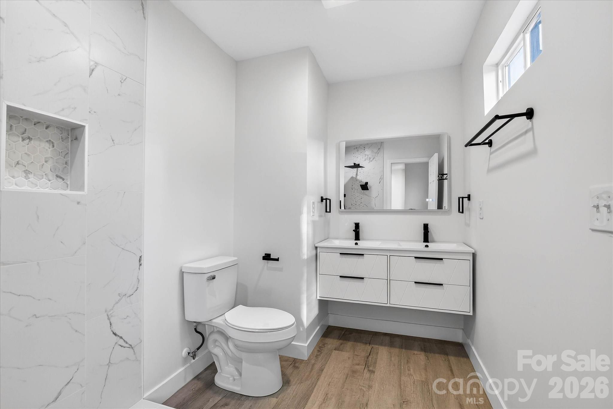 817 Mable Avenue Kannapolis, NC 28083 - Photo 15 of 20 a bathroom with a toilet sink and a mirror