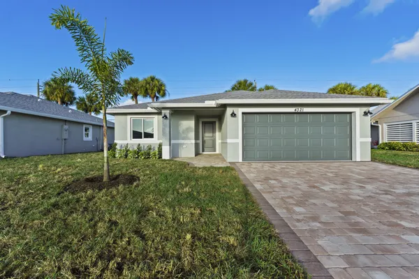 a house view with a backyard space