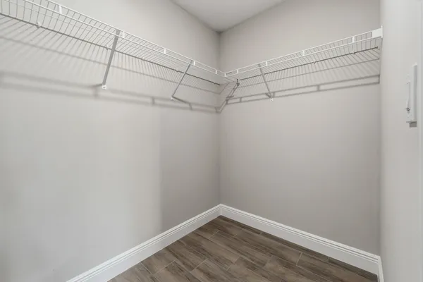 an aerial view of a house with a garden and lake view
