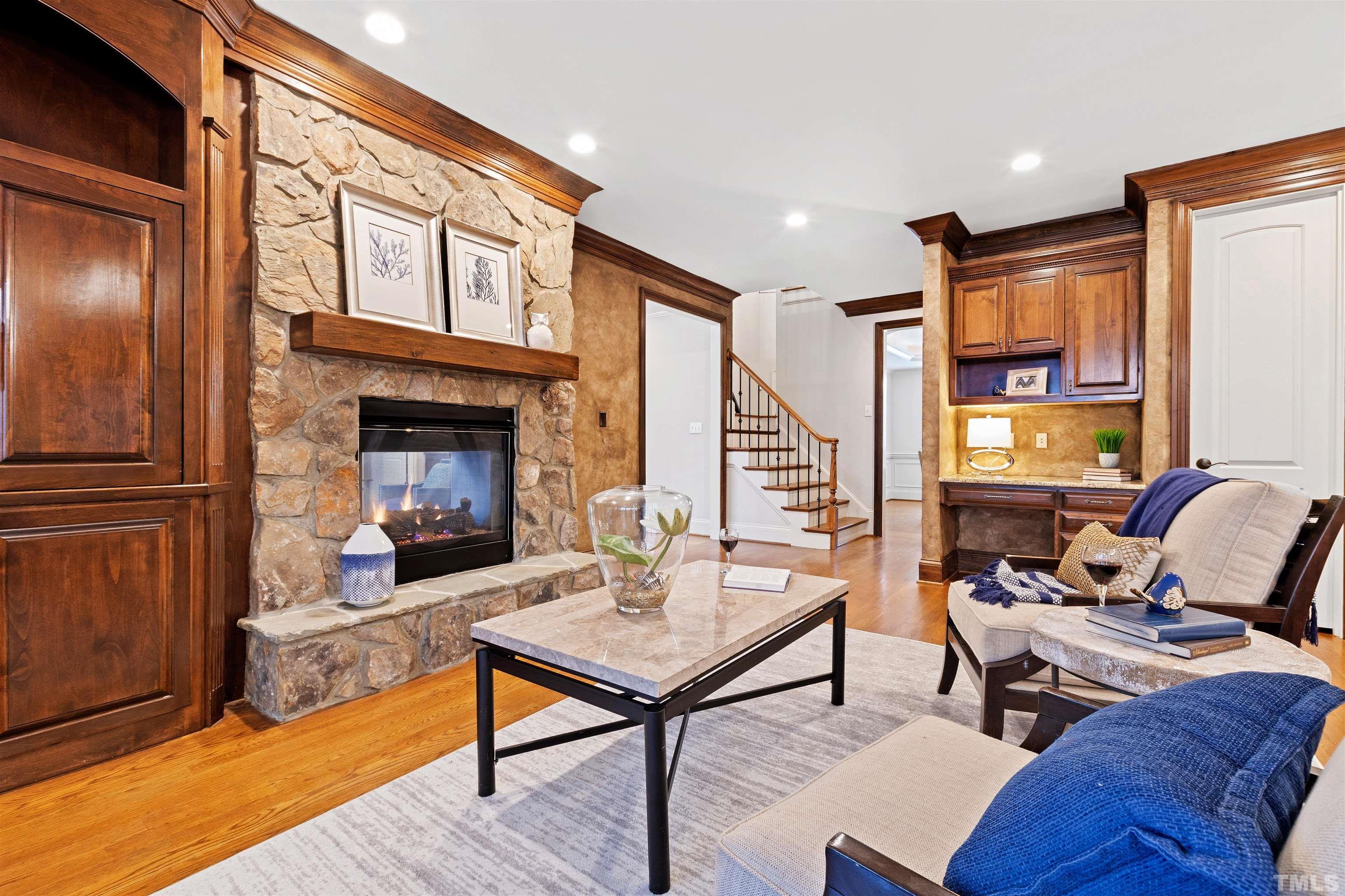 1313 Caistor Lane Raleigh, NC 27614 - Photo 23 of 84 a living room with furniture wooden floor and a fireplace