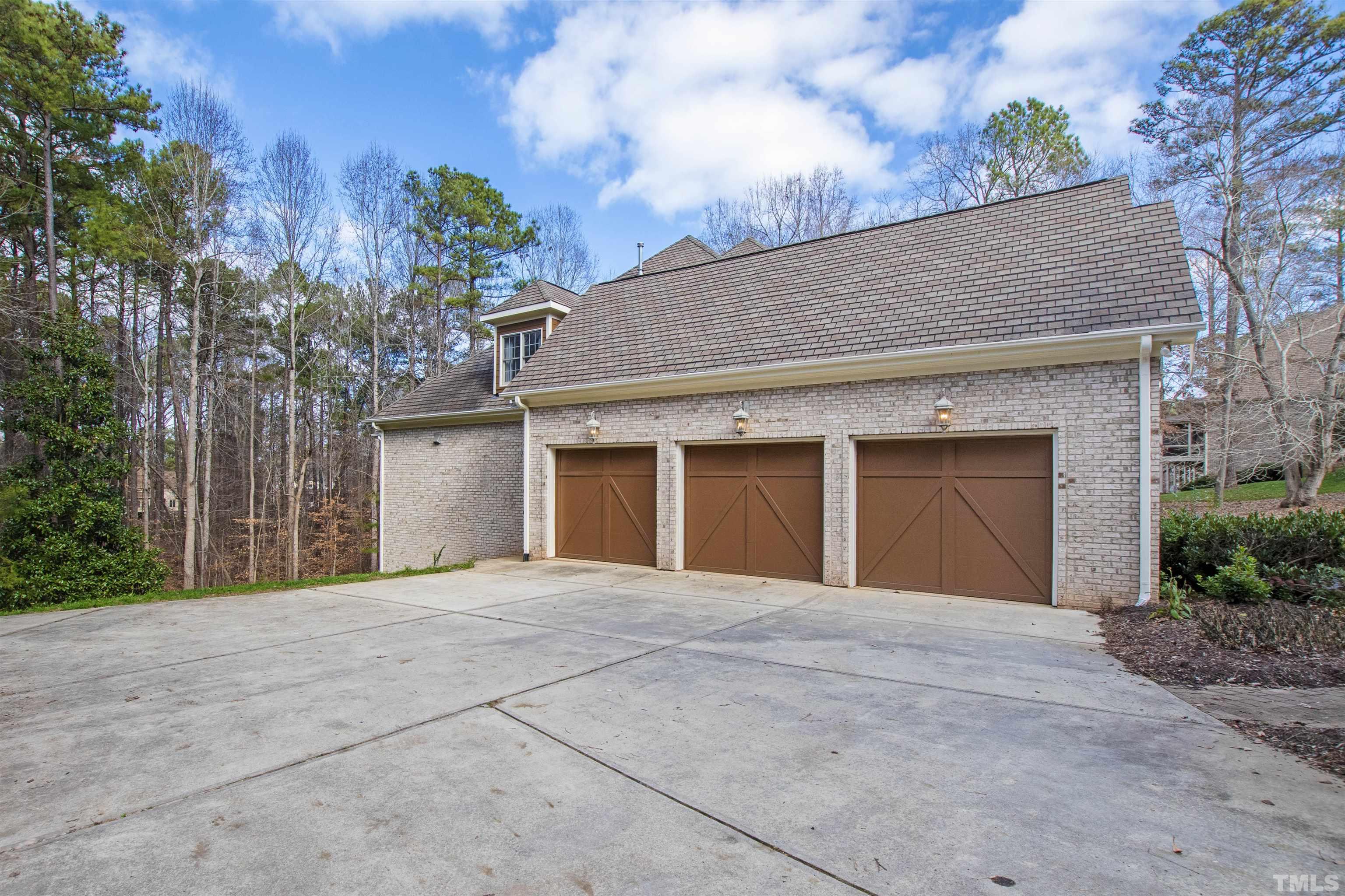 1313 Caistor Lane Raleigh, NC 27614 - Photo 3 of 84 a front view of a house with a yard and garage
