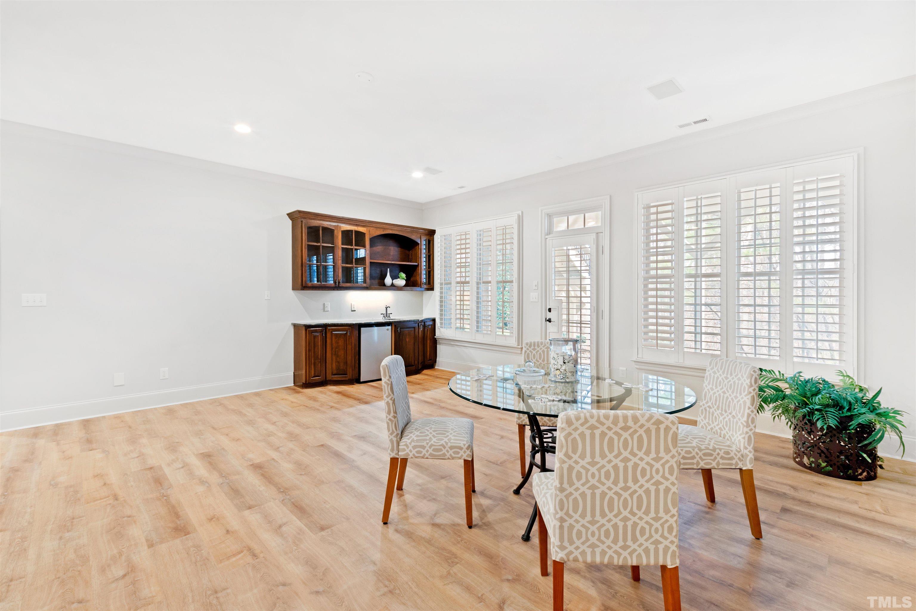 1313 Caistor Lane Raleigh, NC 27614 - Photo 52 of 84 a living room with furniture a table and a potted plant