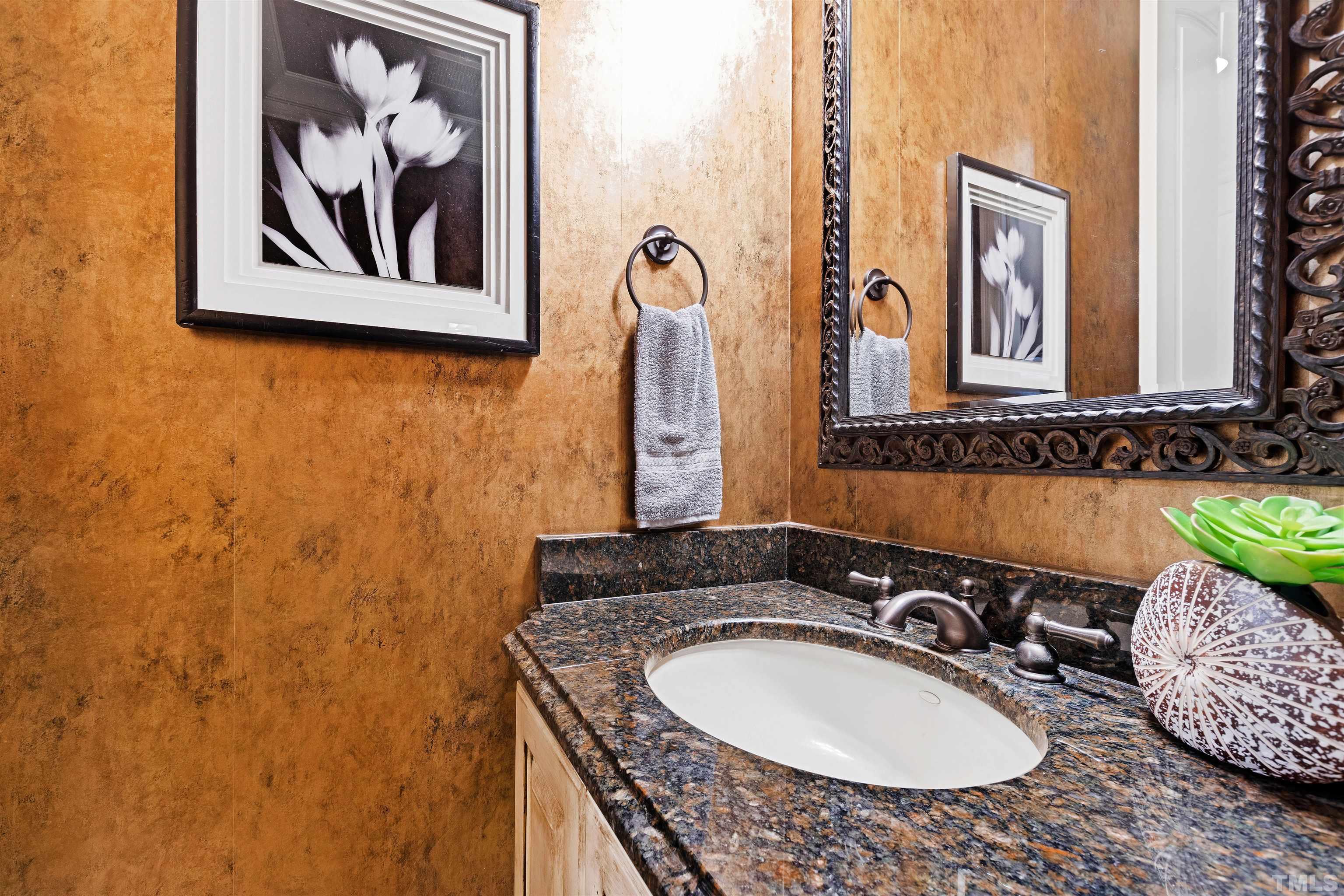 1313 Caistor Lane Raleigh, NC 27614 - Photo 53 of 84 a bathroom with a granite countertop sink and a mirror