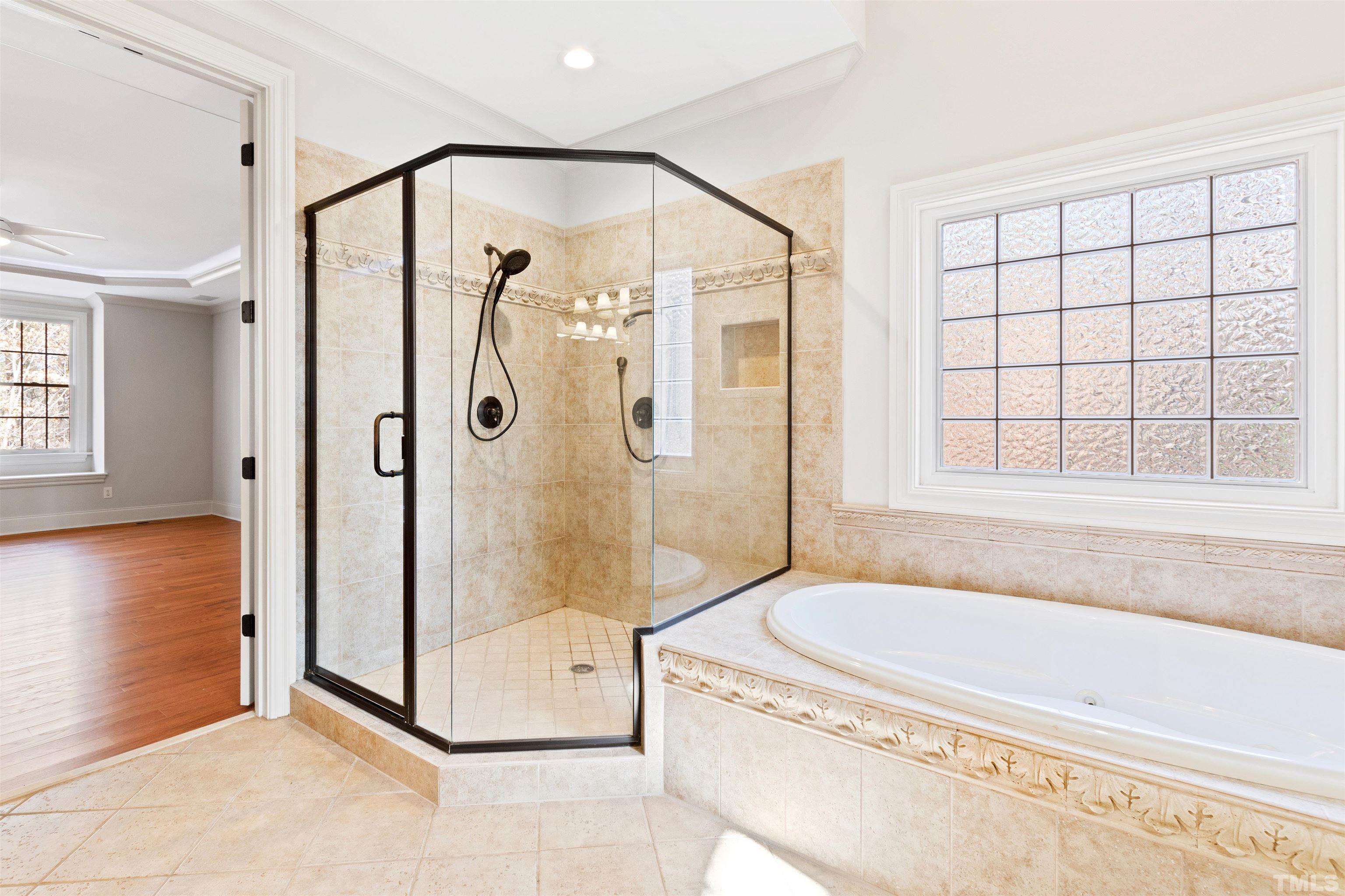1313 Caistor Lane Raleigh, NC 27614 - Photo 69 of 84 a bathroom with a granite countertop tub shower and sink