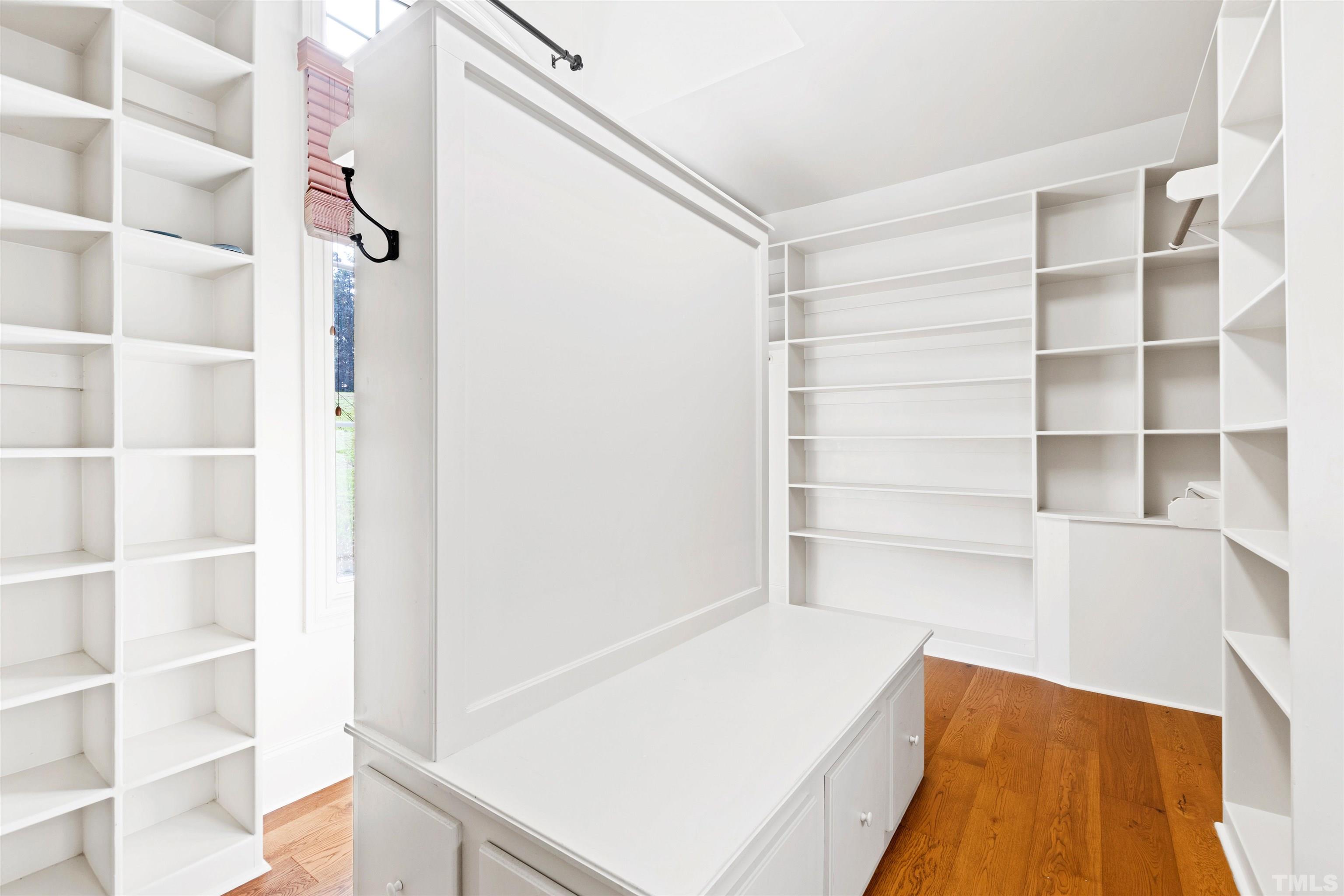 1313 Caistor Lane Raleigh, NC 27614 - Photo 82 of 84 a view of walk in closet with empty racks