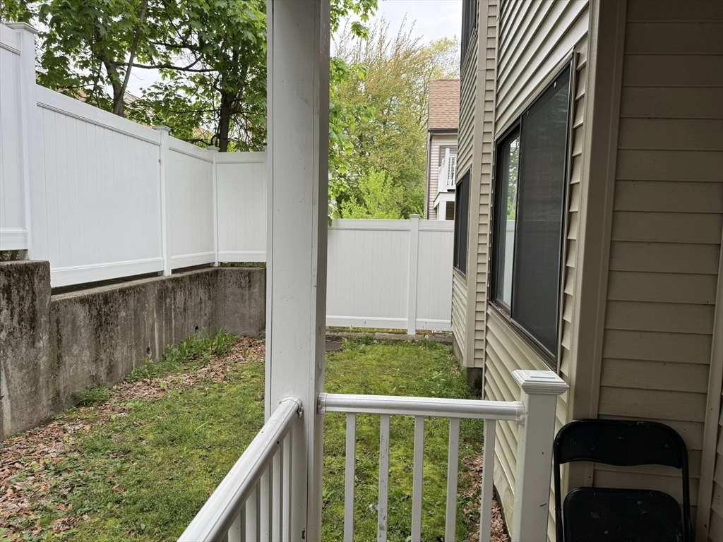 11 Hulbert Road, Unit 15 Worcester, MA 01603 - Photo 5 of 9 a view of a balcony with yard