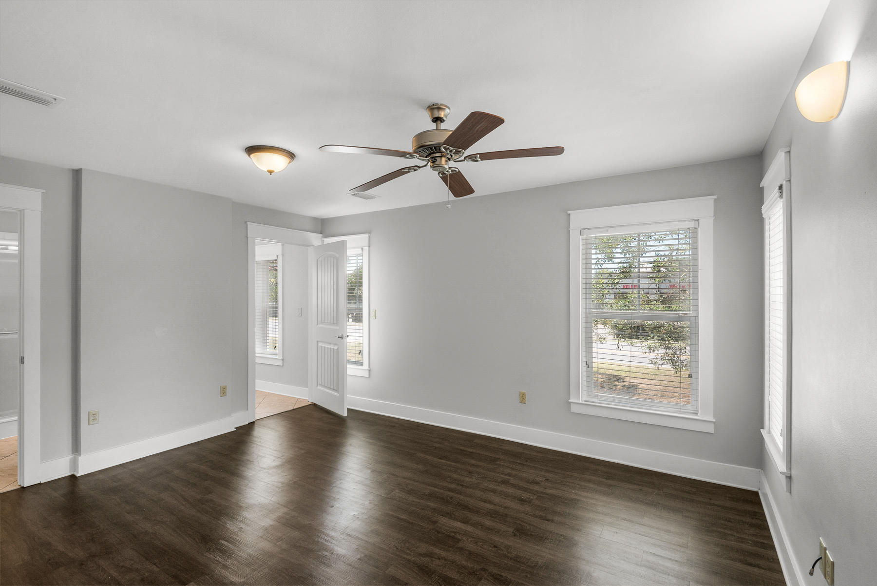 15 Seaspring Cove Santa Rosa Beach, FL 32459 - Photo 11 of 43 a view of empty room with wooden floor and fan