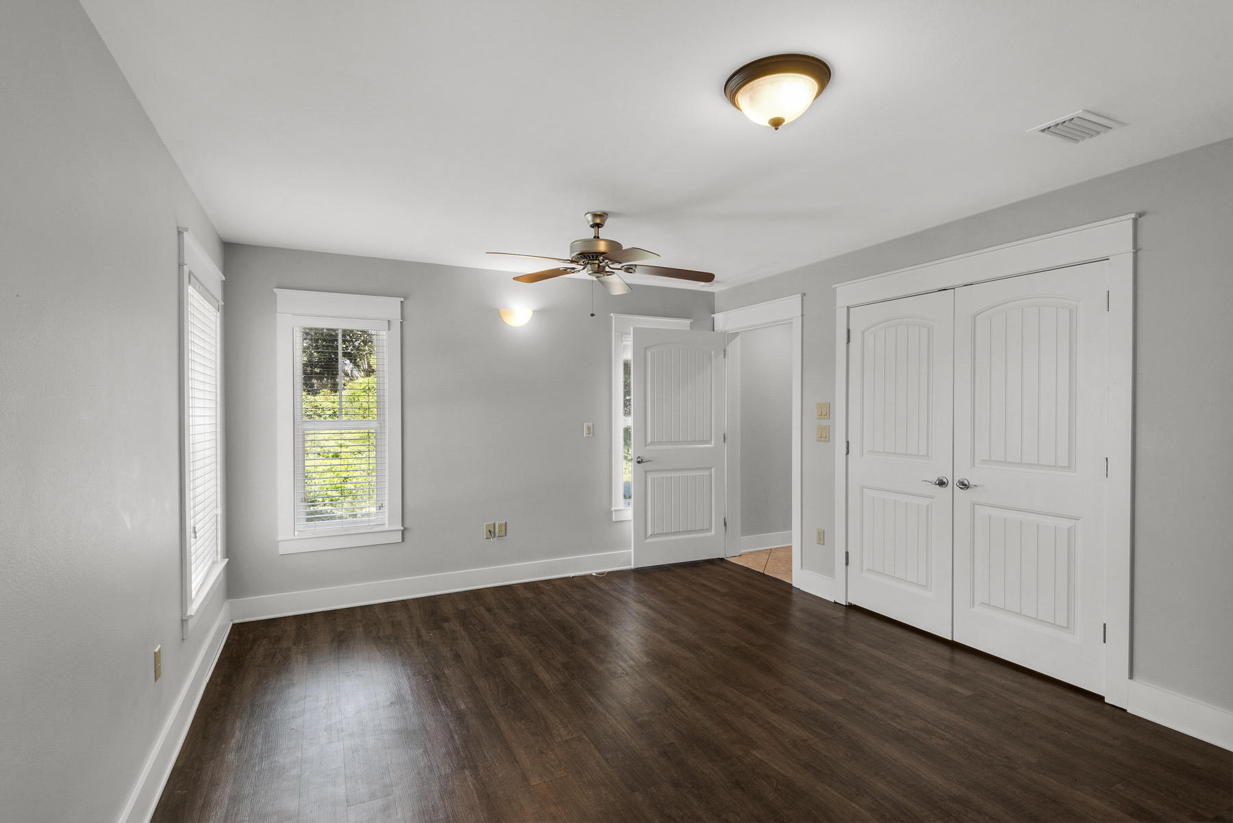 15 Seaspring Cove Santa Rosa Beach, FL 32459 - Photo 13 of 43 an empty room with wooden floor and windows