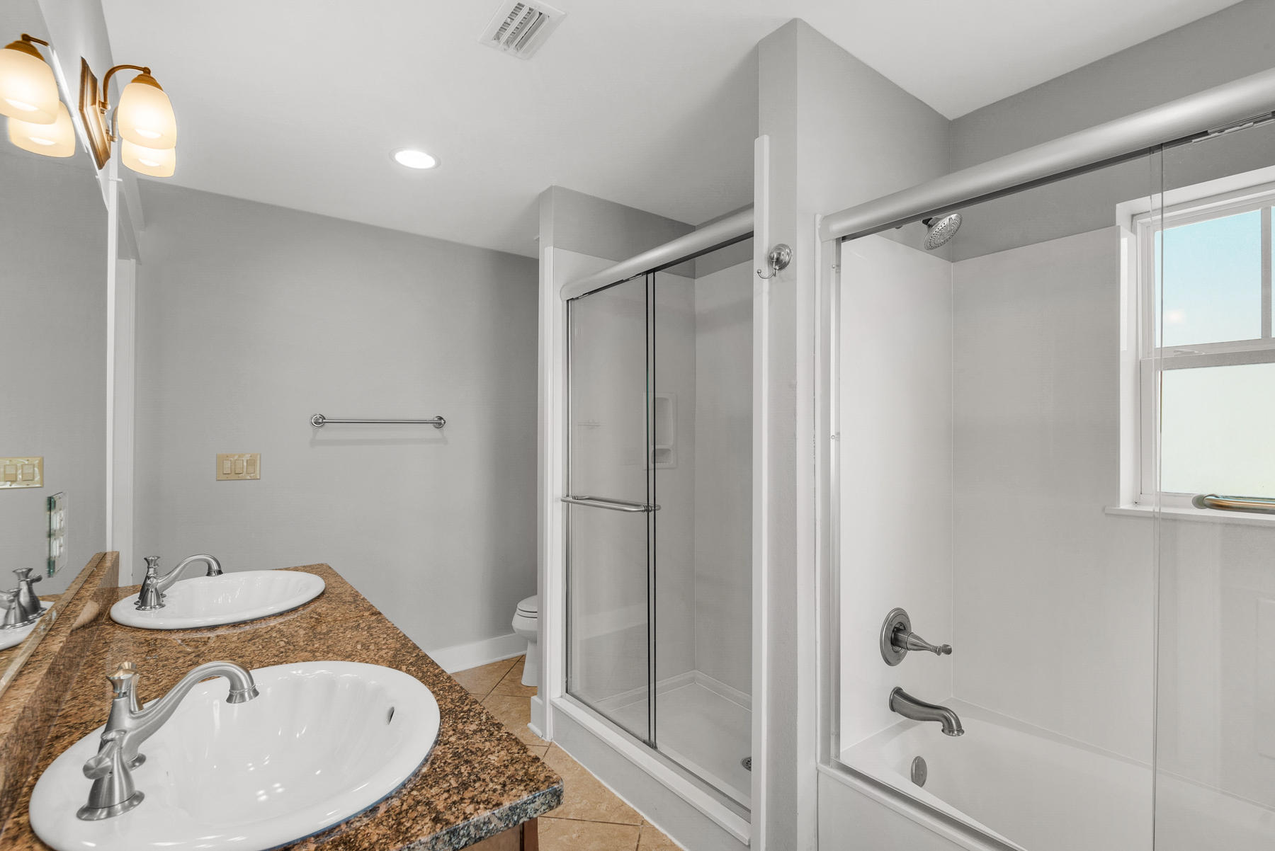 15 Seaspring Cove Santa Rosa Beach, FL 32459 - Photo 15 of 43 a bathroom with a granite countertop sink toilet and shower