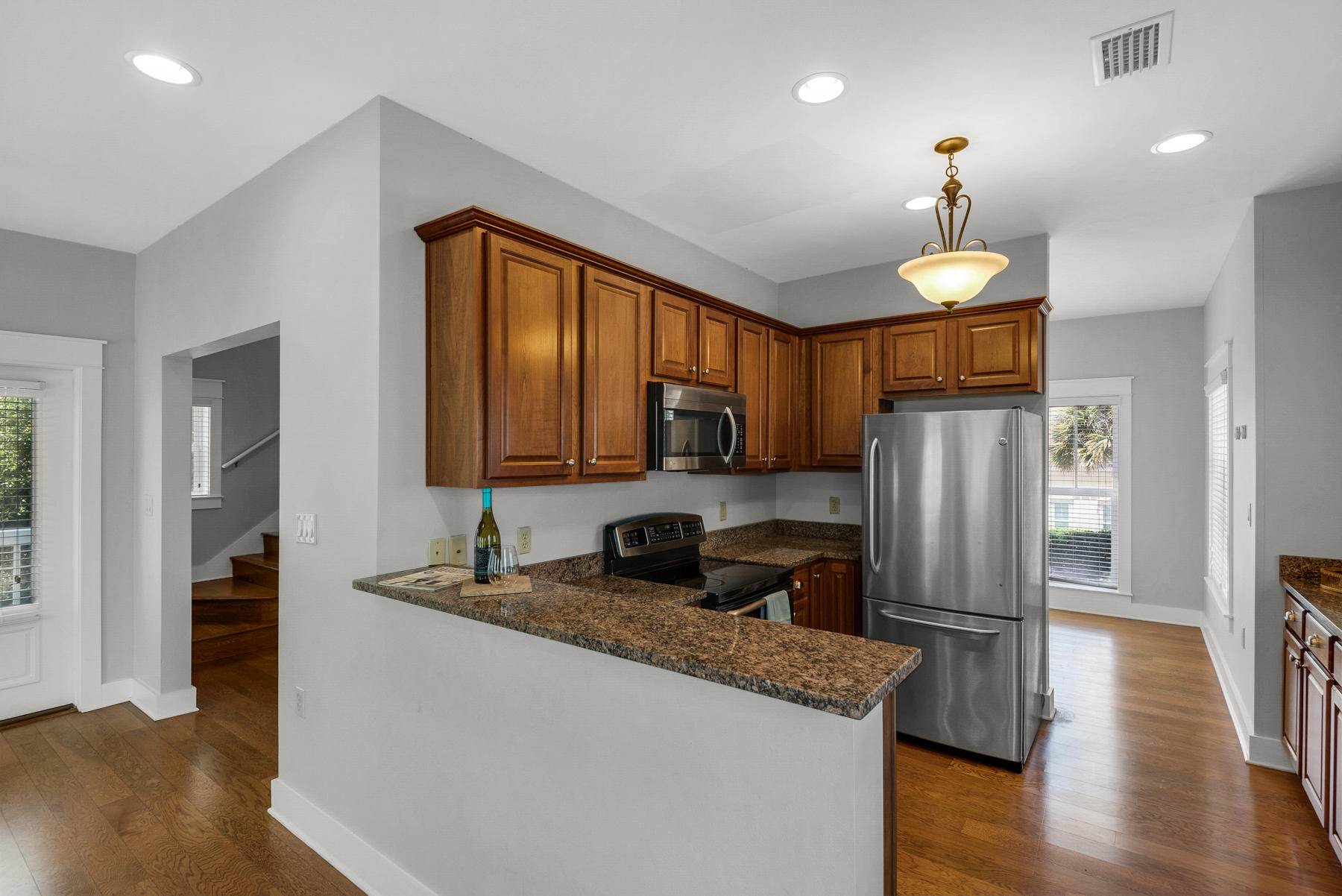 15 Seaspring Cove Santa Rosa Beach, FL 32459 - Photo 22 of 43 a kitchen with stainless steel appliances granite countertop a refrigerator a stove a sink and a microwave