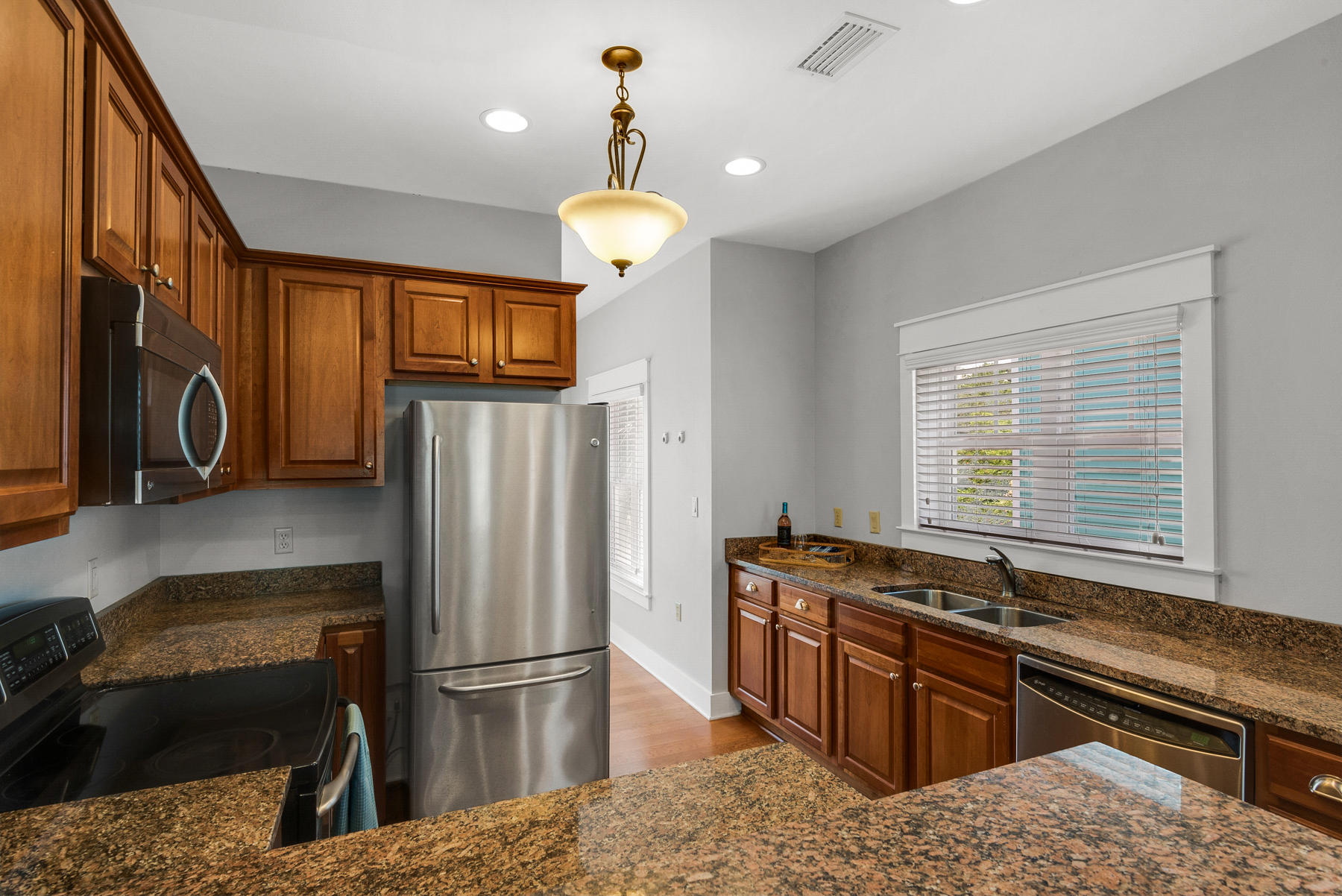 15 Seaspring Cove Santa Rosa Beach, FL 32459 - Photo 23 of 43 a kitchen with stainless steel appliances granite countertop a refrigerator a stove and a sink