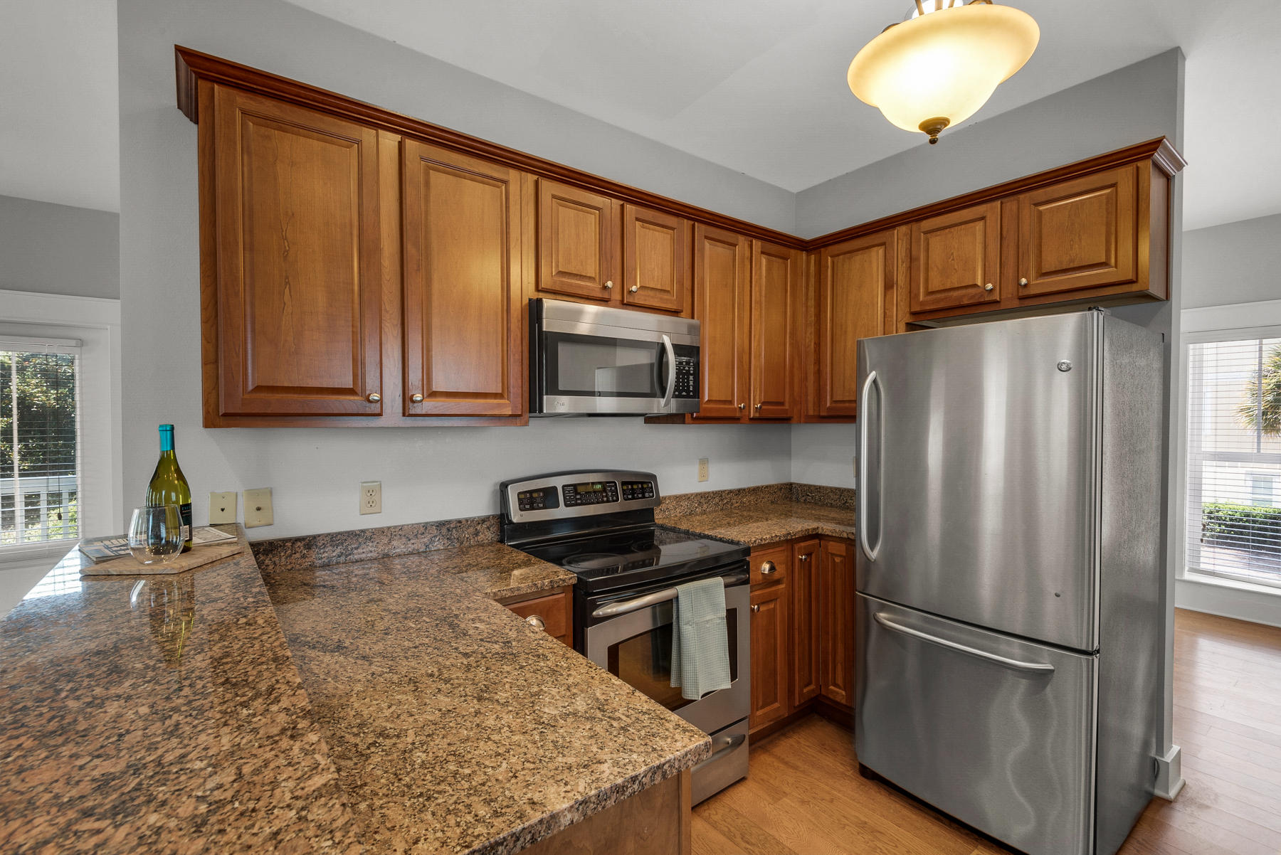 15 Seaspring Cove Santa Rosa Beach, FL 32459 - Photo 25 of 43 a kitchen with stainless steel appliances granite countertop a refrigerator stove and microwave