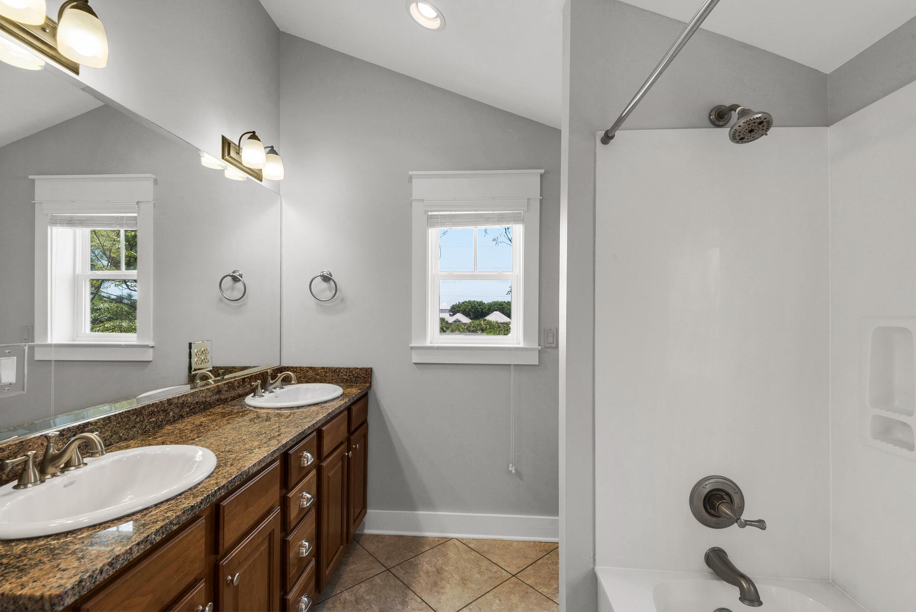 15 Seaspring Cove Santa Rosa Beach, FL 32459 - Photo 38 of 43 a bathroom with a granite countertop sink a mirror and a window