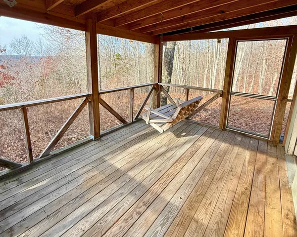 a view of a balcony with wooden floor