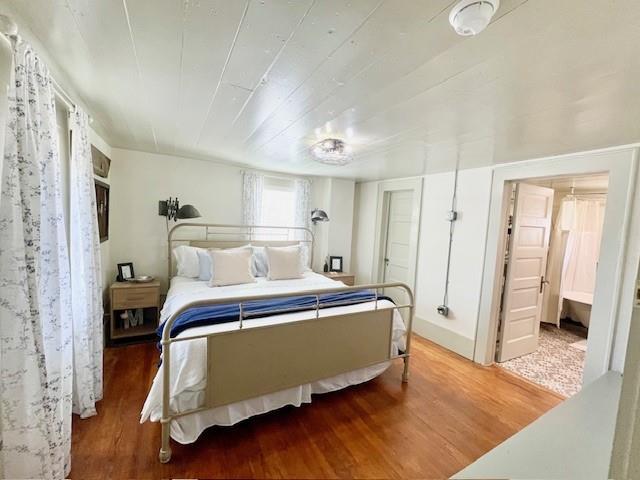 302 East Shoemaker Street Decatur, TX 76234 - Photo 12 of 21 a bed room with a bed and a walk in closet