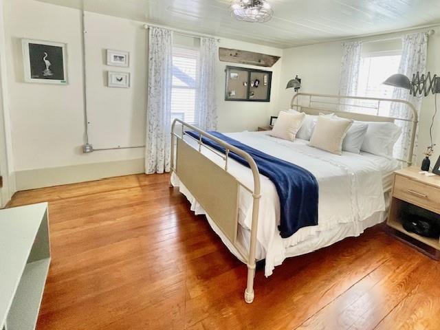 302 East Shoemaker Street Decatur, TX 76234 - Photo 15 of 21 a spacious bedroom with a bed and a night stand