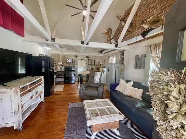 a living room with furniture and a flat screen tv