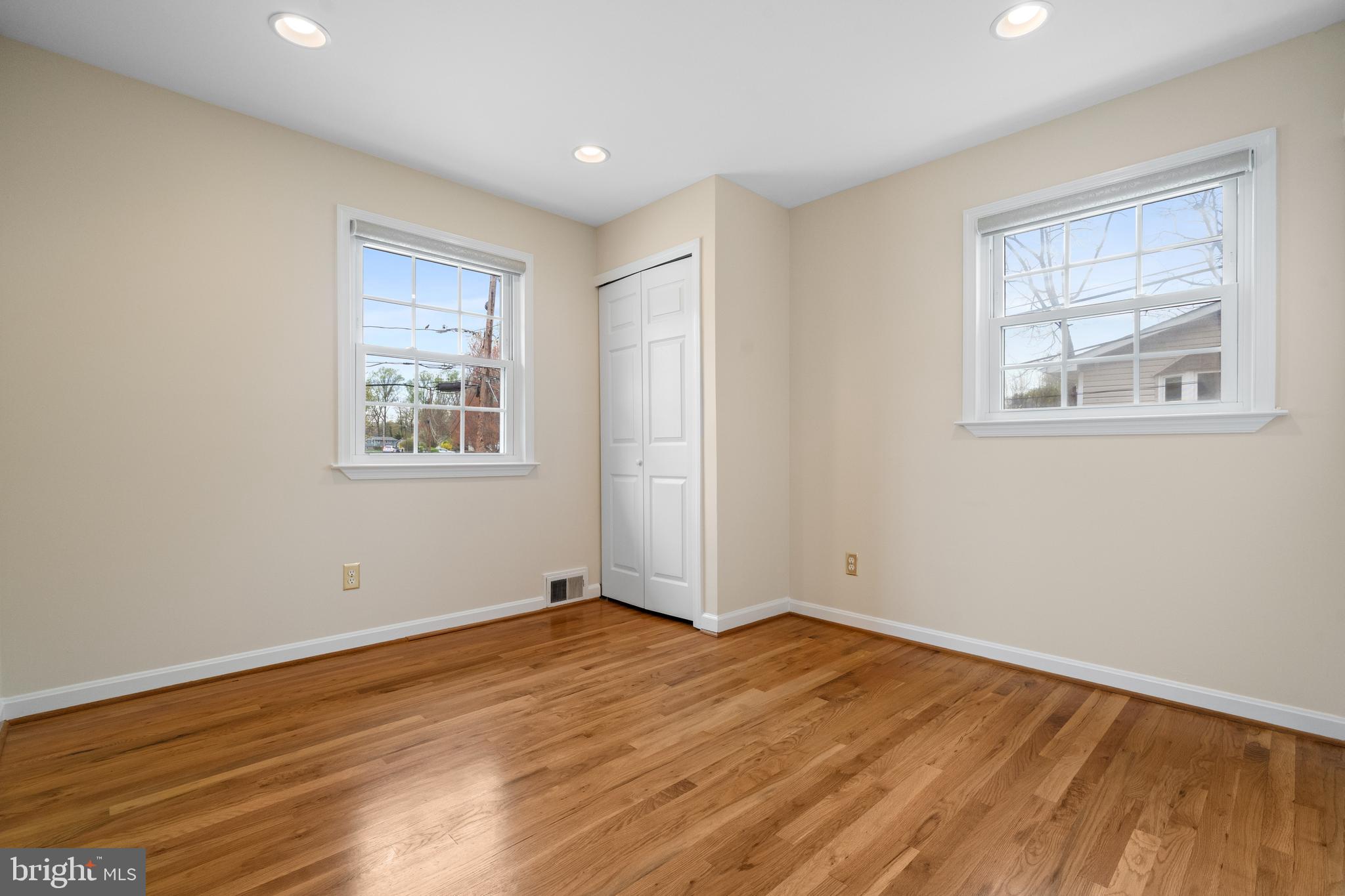 6119 Greeley Boulevard Springfield, VA 22152 - Photo 17 of 38 a view of empty room with wooden floor and fan