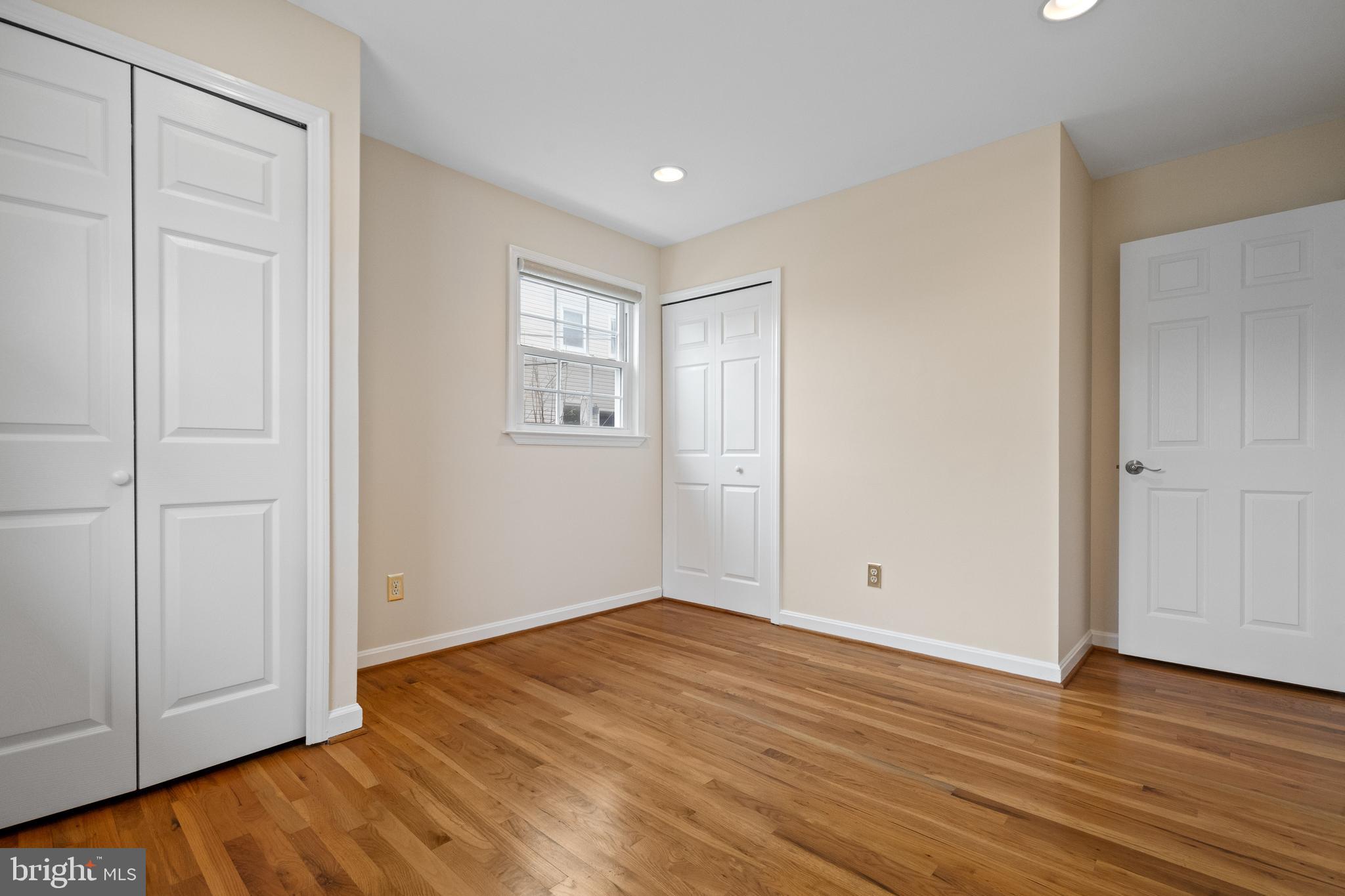 6119 Greeley Boulevard Springfield, VA 22152 - Photo 18 of 38 a view of an empty room with wooden floor